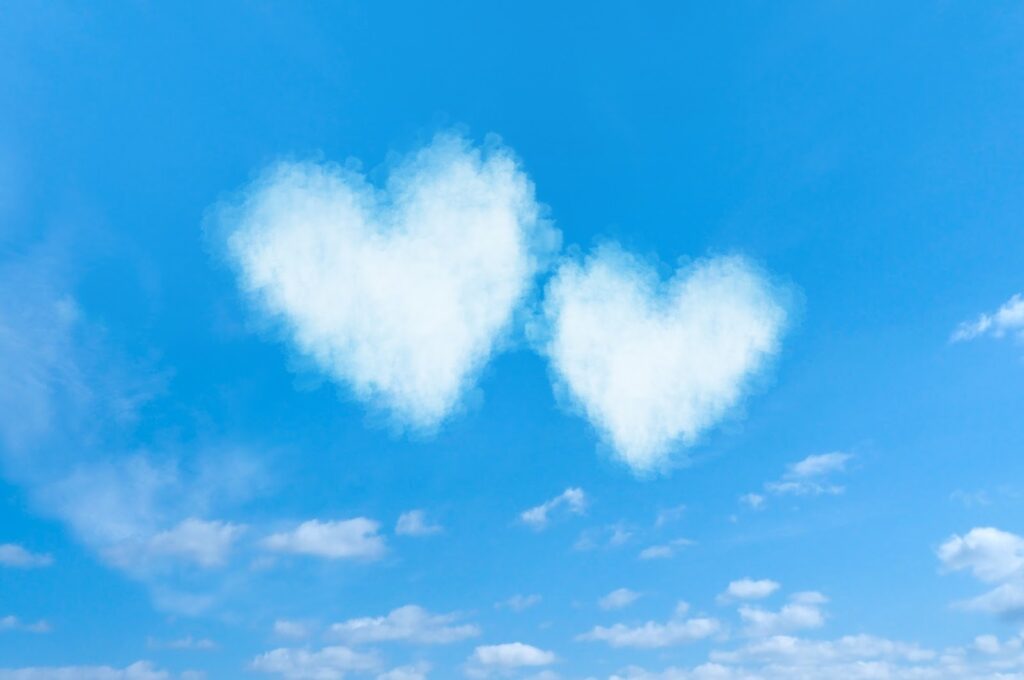 Two heart-shaped white clouds floating side by side in the blue sky : Breathing Techniques for Anxiety