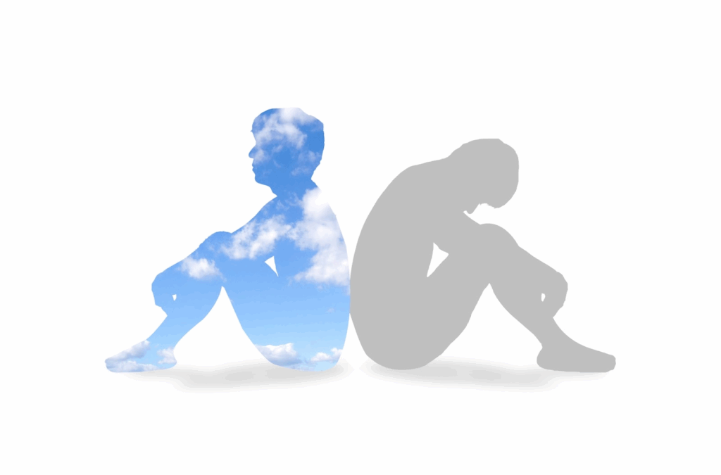 Silhouette of two people sitting back-to-back, one filled with blue sky and clouds, the other in gray, symbolizing contrast between hope and depression.:Buddhist meditation