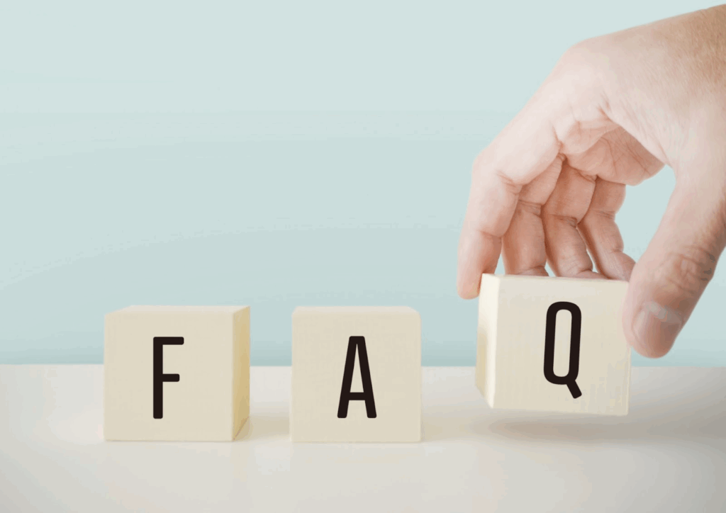 Blocks spelling "FAQ," with a hand lifting the block marked "Q" : Meditation timers