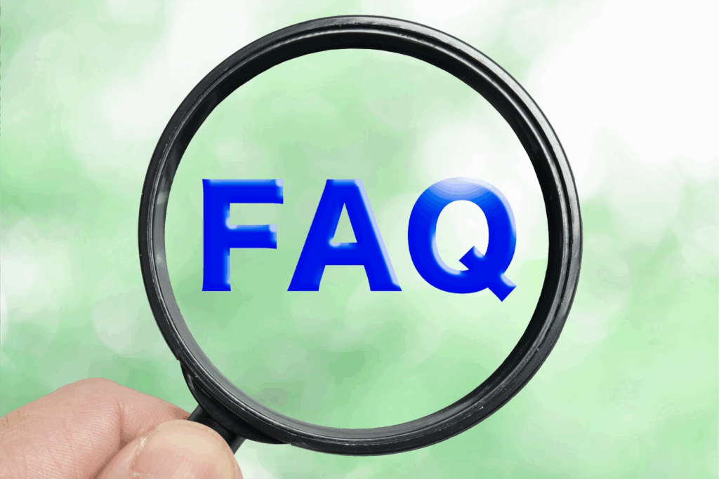 The word “FAQ” in blue letters is seen through a magnifying glass against a soft green blurred background, symbolizing questions, answers, and information search :Meditation Positions
