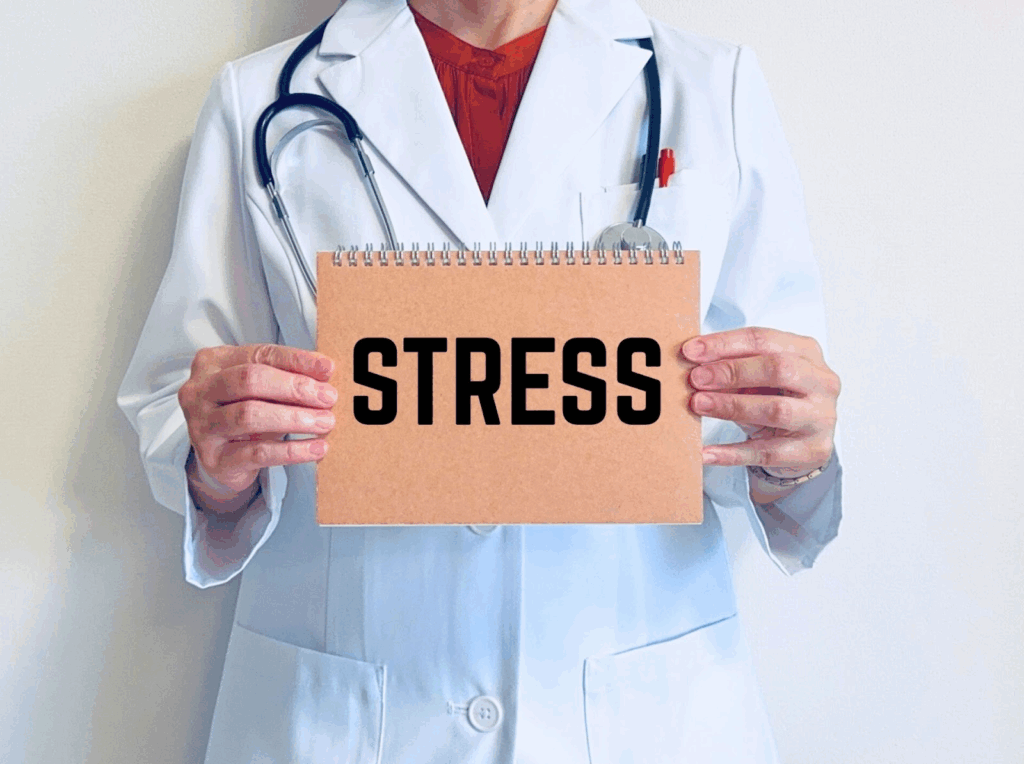 Doctor in a white coat holding a board with the word "STRESS" written on it :Breathing Exercise for Nerves