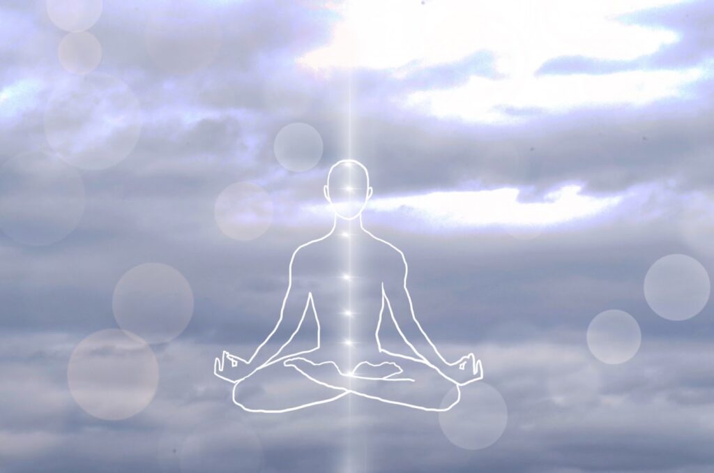A glowing outline of a meditating person in lotus position is drawn against a cloudy sky, with points of light aligned vertically along the body, symbolizing chakras : Body Scan Meditation
